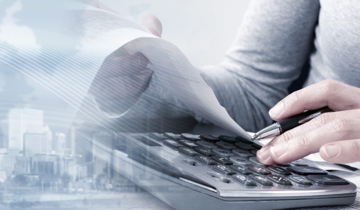 Bookkeeper hands working in office with calculator