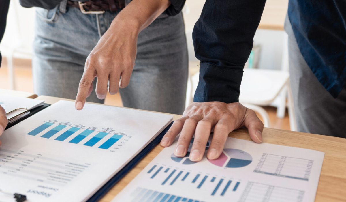 Business People Meeting to analyse and discuss and brainstorming the financial report chart data in office, Financial advisor teamwork and accounting concept