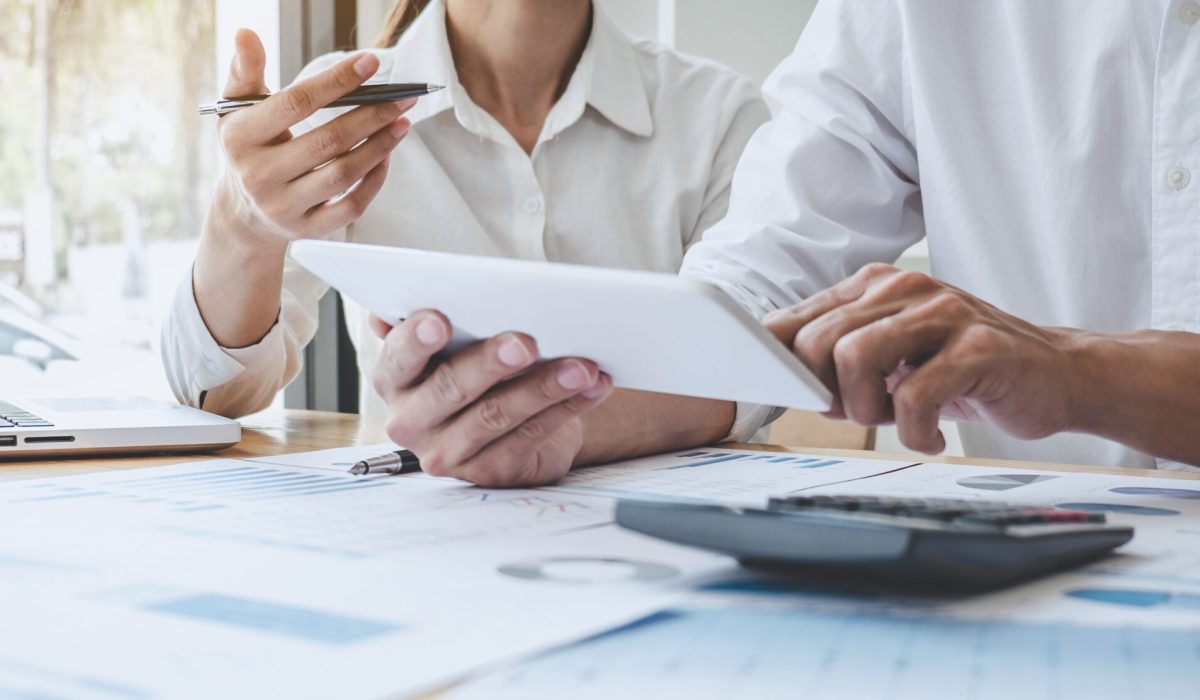 Two business colleague meeting to brainstorm the new project business strategy plan and analysis data document, finance and accounting concept Briefing, brainstorming, consulting.